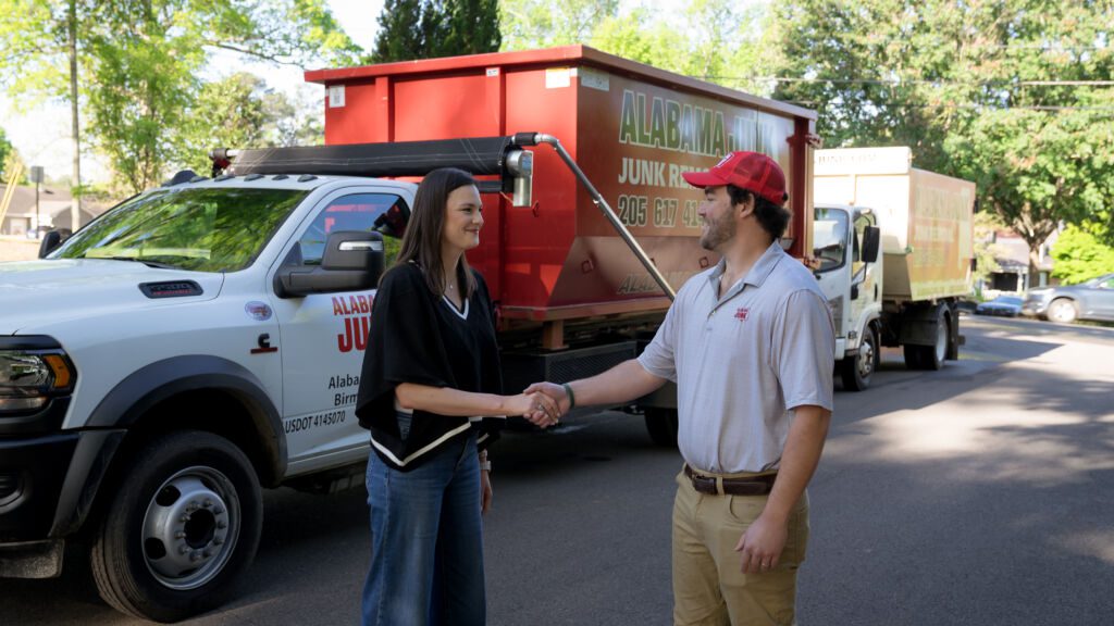 Alabama Junk Removal crew shaking hands with happy client after junk removal services in Birmingham